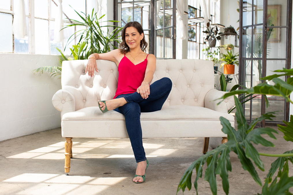 Krishanti sitting on couch